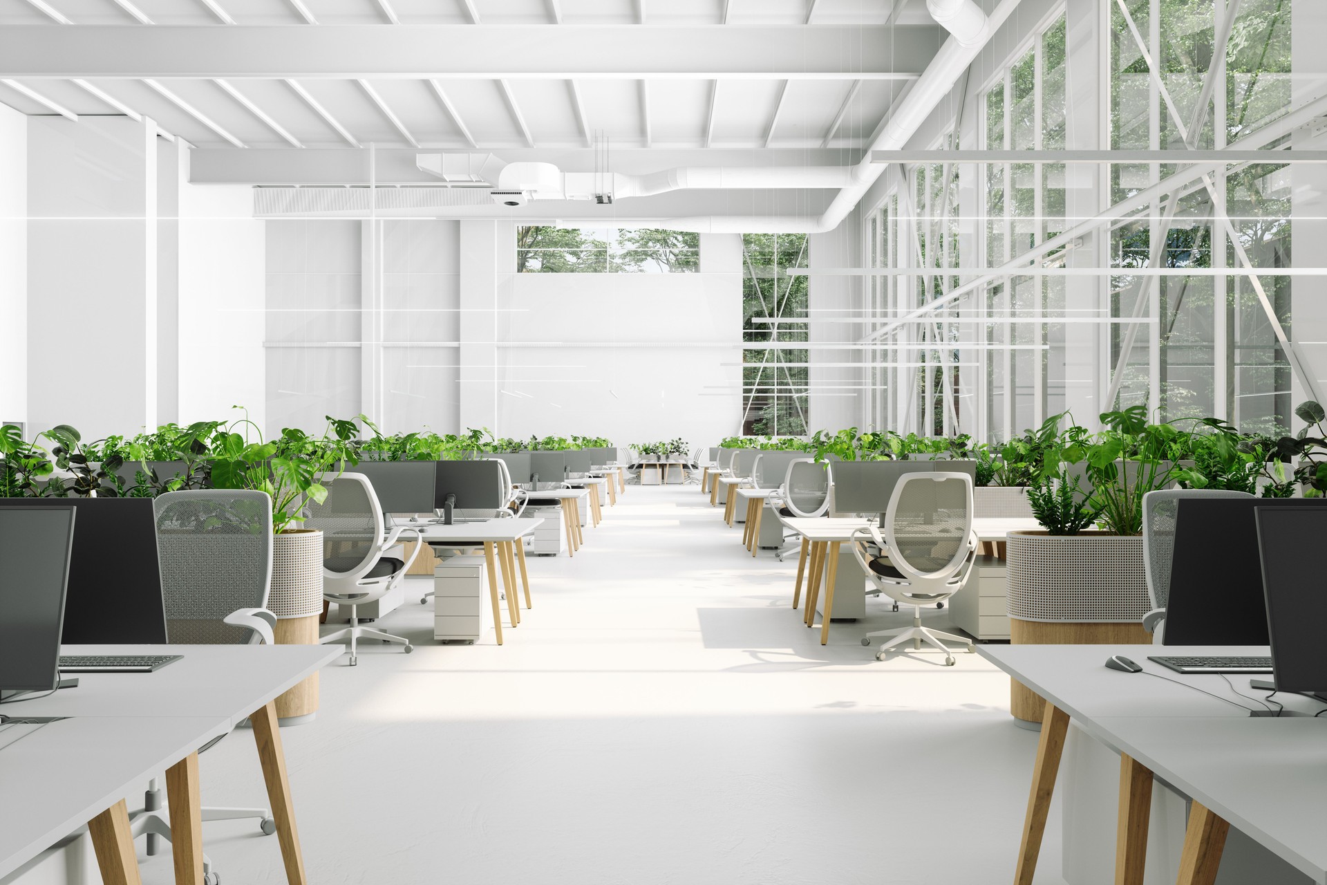 Eco-Friendly Modern Open Plan Office Interior With Tables, Office Chairs, Computers And Plants